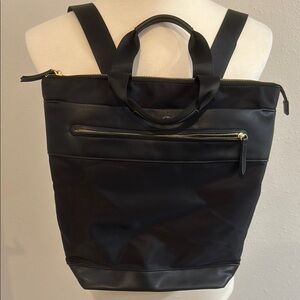 Sleek Black Bag with Gold Zippers